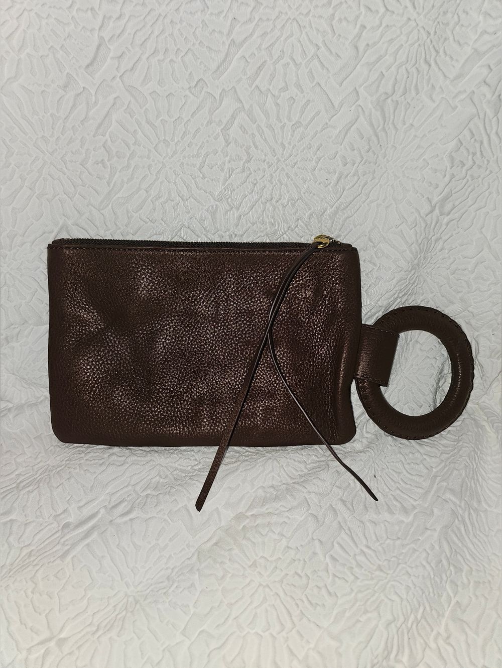 NWOT Hobo Storm Clutch in the color Acorn